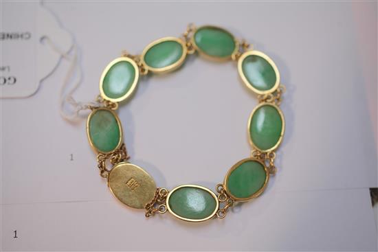 A Chinese gold and cabochon jadeite bracelet, 6.5in.